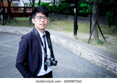 Slash. Slashie. Man Is A Sales Representative And Photographer At The Same Time. One Person/multiple Careers