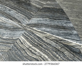 Slate, veiny stone pattern flooring surface in neutral colors. Emphasizing a smooth and glossy texture.