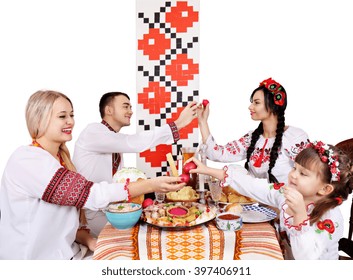 Slavic Family At The Festive Easter Table With Snacks