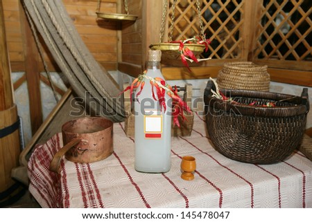 Slavic interior with a bottle of homemade alcohol