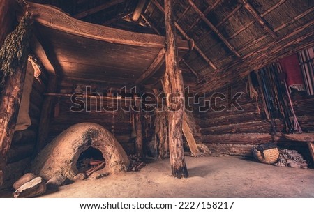 Slavic and Viking village of Wollin. Old wooden and fisherman's hut. Close-up of an old house in the Middle Ages. Old fisherman's hut and wooden hut with spices and pots. evil Dead