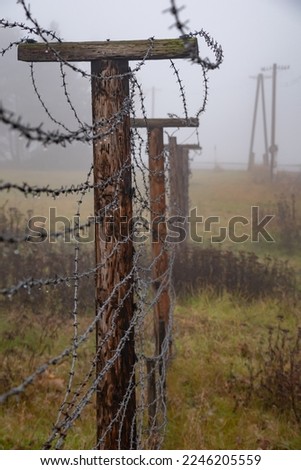 SLAVONICE, CZECH REPUBLIC (CZECHIA) – NOVEMBER 15, 2022: Barbered wire fence as a memorial of the Iron Curtain between West and East in Kadolec (part of Slavonice) near the state border with Austria