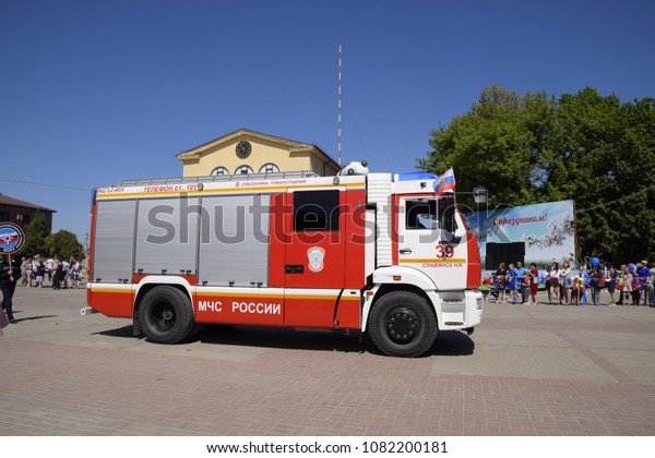 Slavyansk-on-Kuban, Russia - May 1, 2018: Service\
transport workers on the festive May procession.Celebrating the\
first of May, the day of spring and work. May Day parade on the\
Theater Square in\
the