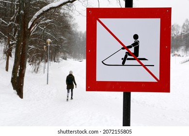 Sledding Forbidden Sign In The Snowy Park. Children Safety During Winter Holidays