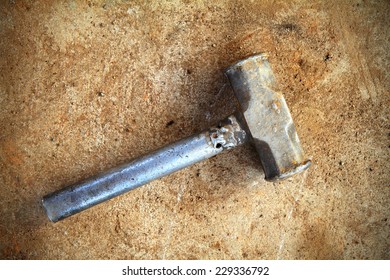 A Sledge Hammer Old And Rusty 