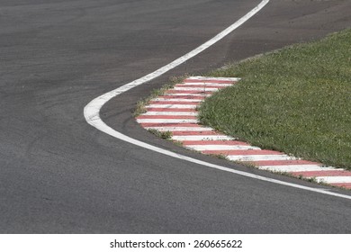 Sleek Asphalt And Danger At The Bend Of The Motorbike Track, MotoGP, Desaturated