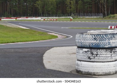 Sleek Asphalt And Danger At The Bend Of The Motorbike Track And Red Orange Striped Cones, MotoGP