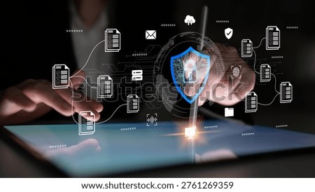 A sleek digital security scene featuring hands interacting with a tablet, showcasing symbols of protection and data management to emphasize modern technology and cybersecurity themes. Ledger