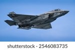 A sleek F-35 fighter jet soars through the sky, showcasing cutting-edge stealth technology and advanced aerodynamics. Perfect for aviation enthusiasts and modern military aviation decor.