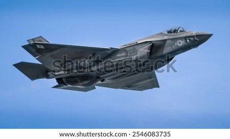 A sleek F-35 fighter jet soars through the sky, showcasing cutting-edge stealth technology and advanced aerodynamics. Perfect for aviation enthusiasts and modern military aviation decor.
