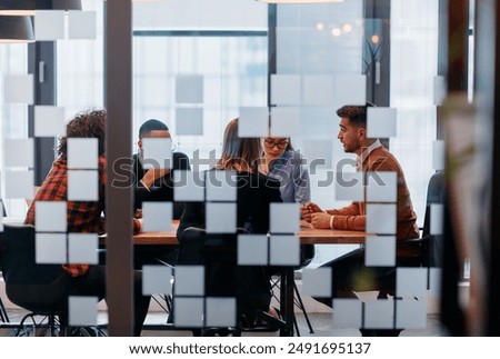 Similar – Image, Stock Photo Multiethnic team collaborating in a modern coworking space