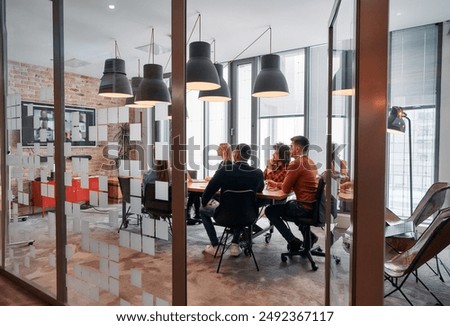 Similar – Image, Stock Photo Multiethnic team collaborating in a modern coworking space