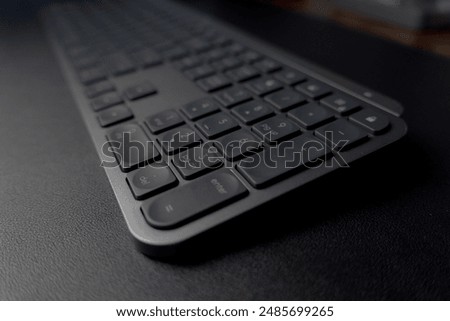 Sleek Logitech wireless keyboard. Low-profile keys for comfortable typing. Modern design with space-saving layout. Perfect for home office or professional workspace. Enhances productivity.