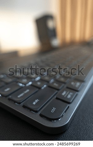 Sleek Logitech wireless keyboard. Low-profile keys for comfortable typing. Modern design with space-saving layout. Perfect for home office or professional workspace. Enhances productivity.