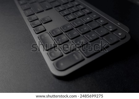 Sleek Logitech wireless keyboard. Low-profile keys for comfortable typing. Modern design with space-saving layout. Perfect for home office or professional workspace. Enhances productivity.