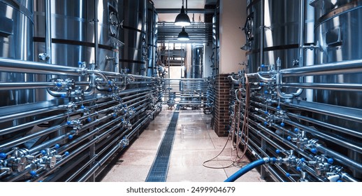 Sleek modern brewery interior with rows of shiny stainless steel tanks connected by intricate piping systems, emphasizing efficient craft beer production - Powered by Shutterstock