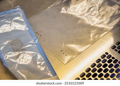 A sleek, modern office desk with a rectangular wooden surface. The desk features a glass top and metal accents, with paper and office equipment neatly org. Elements of this image furnished by NASA - Powered by Shutterstock