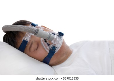 Sleep Apnea Therapy, Man Sleeping In Bed Wearing CPAP Mask.
Healthy Senior Man Sleeping Deeply, Happy On His Back Without Snoring,isolated White Background