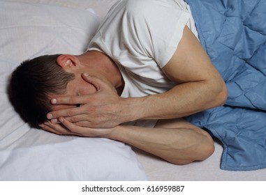 Sleep Disorders And Problems. Man Struggling With Insomnia.