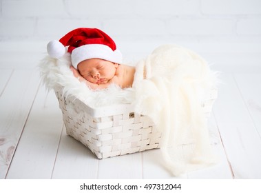 Sleeper Newborn Baby In A Christmas Santa Cap