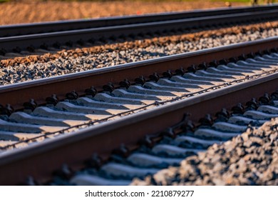 Sleepers And Rails With Screws In The Track Bed With Ballast