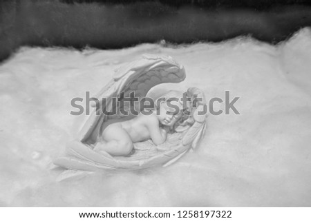 Sleeping angel on a cloud