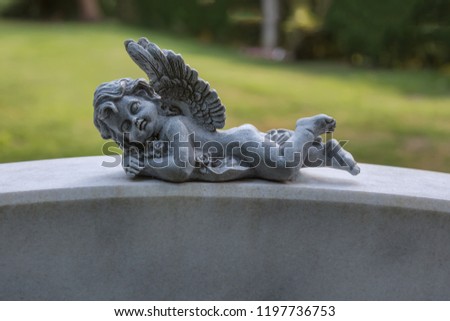 Sleeping angel on a gravestone