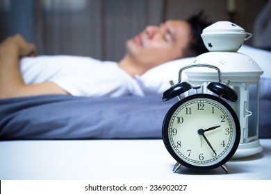 Sleeping Asian Man In Bed At Night