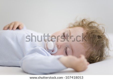 Similar – Baby asleep while parents caress