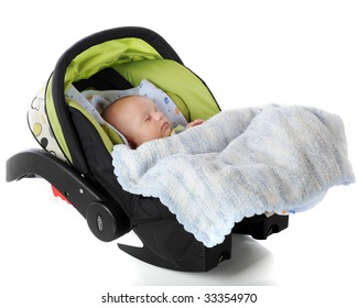 A Sleeping Baby In An Infantm Carrier/car Seat.  Isolated On White.