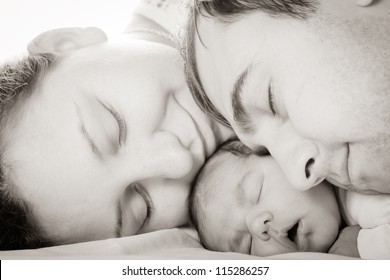 Sleeping Baby With Mom And Dad, Closeup Faces