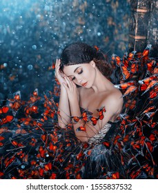 Sleeping Beauty portrait. young brunette woman, creative gentle makeup, fashion vintage glamorous collected hairstyle. Brunette girl. fantasy dress with butterflies. Blue orange art color photography