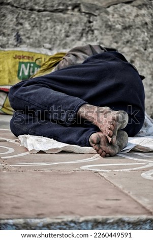 Sleeping begger on the Ghat