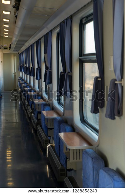 Sleeping car of a passenger train. Corridor inside\
the train car.