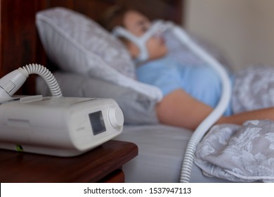 Sleeping with cpap machine and copy space 
