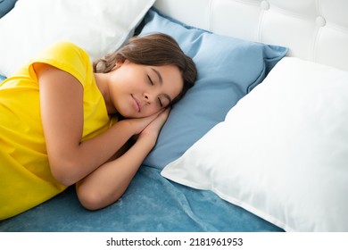 Sleeping and dreaming kids. Kid lying and sleeping on bed. Child teen sleeps in the bed. Sleeper, napping concept.