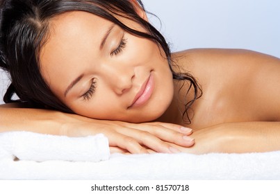 Sleeping And Enjoying Young Asian Girl Laying On The Towel And Smiling With Wet Hairs - Close-up Portrait