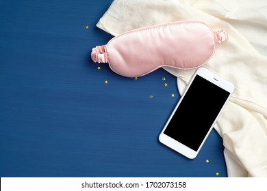 Sleeping Eye Mask, Smartphone With Blank Screen Mockup, Blanket On Classic Blue Background. Healthy Sleep, Sleep Tracker, Diagnostic App With Analysis Concept. Flat Lay, Top View