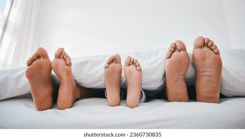 Sleeping, feet and family in a bed with love, relax and resting in comfort in their home together. Barefoot, care and child with mom, father and security in bedroom for sleep, bonding and weekend nap - Powered by Shutterstock