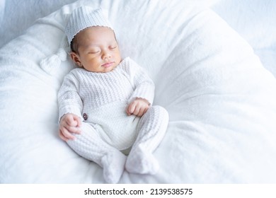 Sleeping New Born Baby, Newborn Kid Sleep Rest on White Fur and White Suit, Beautiful Infant Studio Portrait, One month old