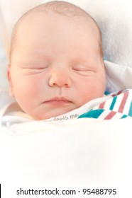 Sleeping Newborn Baby Boy Warped In Hospital Blanket