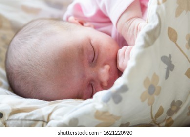 Sleeping Newborn Baby. Cute Little Girl One Week Old At Home. Adorable Lying On Side Covered With Blanket. No Retouch, Newborn Dry Skin.