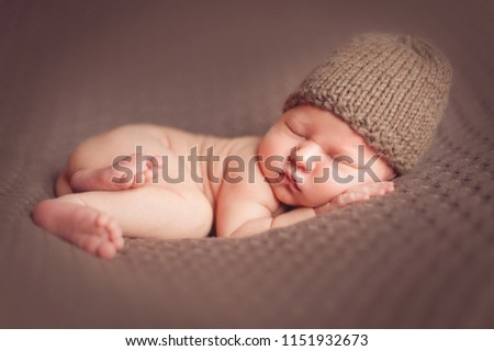 Similar – Image, Stock Photo Newborn baby with pompom hat sleeping and laughing on blanket