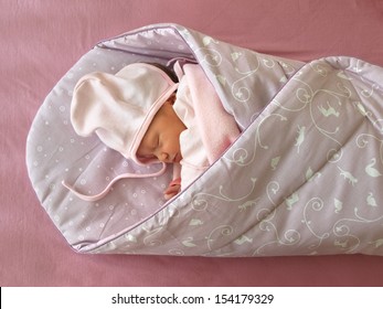 Sleeping Newborn In The Swaddle Wrap Blanket.