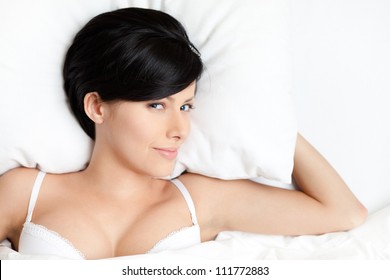 Sleeping Sexy Woman In The Wide Bed, White Background