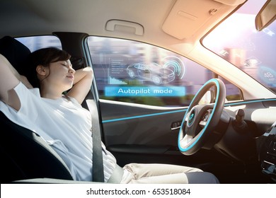 sleeping woman in autonomous car. self driving vehicle. autopilot. automotive technology.