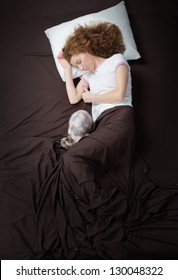 Sleeping Young Woman And Her Cat, View From Above