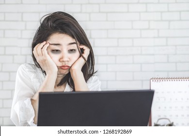 Sleepless Asian Woman Feeling Tired And Sleepy At Workplace Eyes Looking At Computer On Desk Lazy To Work 