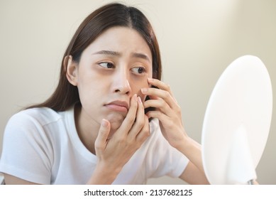 Sleepless Asian Woman Looking Her Face In The Mirror And Worry About Dark Circles Under Eyes