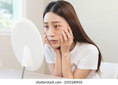 Sleepless Asian Woman Looking Her Face In The Mirror And Worry About Dark Circles Under Eyes